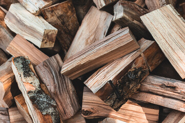 Preparation of firewood for the winter. Firewood background.