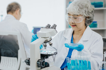 Modern medical laboratory: two scientists work with micropipettes Analyze biochemical samples Advanced Medical Science Laboratory