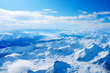 Fototapeta na wymiar Aerial view from the plane to ski resort mountains 