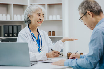 Asian female doctor and male patient talking health concept