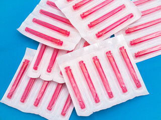 Medical needles protected in red and plasticized containers for medical use and to be used in...