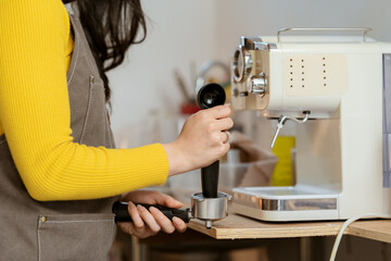 Small business owner, successful businesswoman, beautiful woman standing in coffee shop Portrait of a tanned Asian woman, barista, cafe, business concept owner, seller, SME