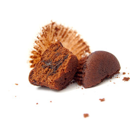 Halved Mini chocolate muffins or brownie cupcake on white background stock photo.
