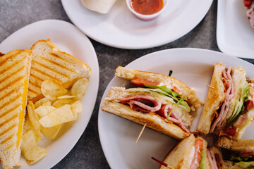 Sandwiches on a table overhead view background 