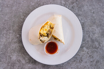 Breakfast tacos on a white plate