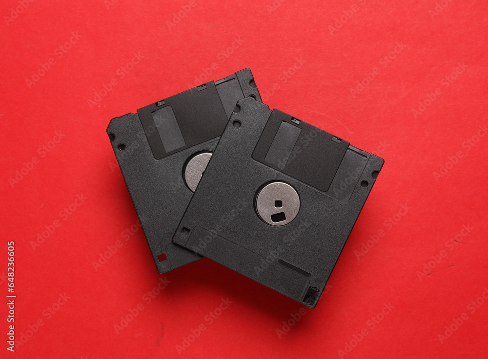 Poster black floppy disks on a red background. retro 80s