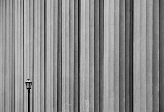 Street Light Against A Background Of Building Columns; Mendoza, Argentina