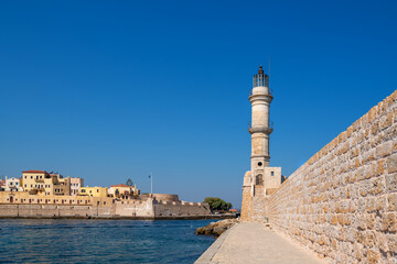 Fototapeta na wymiar Venetian harbour and lighthouse in Chania. Crete, Greece