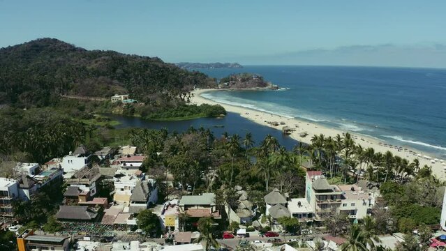 aerial drone footage of San Pancho Beach and Town in mexico, on the ocean.