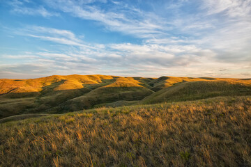 The setting sun lights up the top of the coulees in grasslands national park; Saskatchewan canada