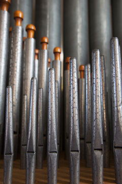 Close up of silver pipes on a musical instrument; Northumberland england