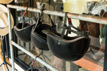 Black Equestrian Helmet for horse care and riding at horse farms.