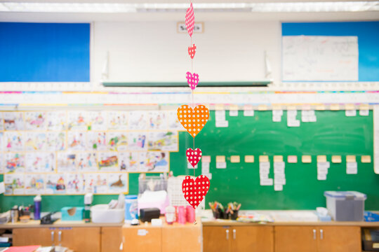 Hearts Hanging In A Row From A Ceiling In A Classroom; Toronto, Ontario, Canada