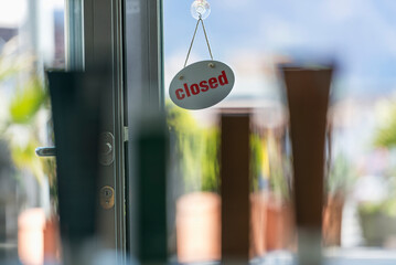 A closed sign on a shop door