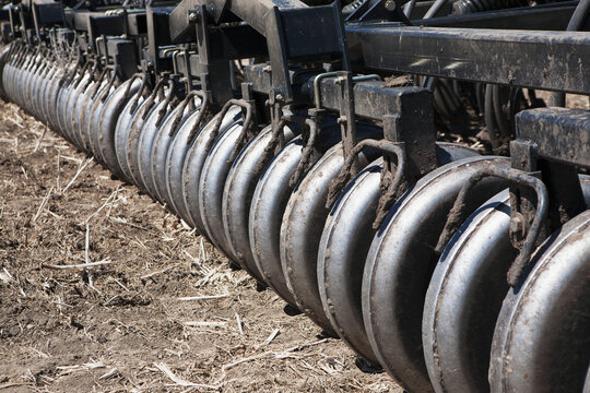 Close up of a series of rollers on an air seeder; Alberta Canada