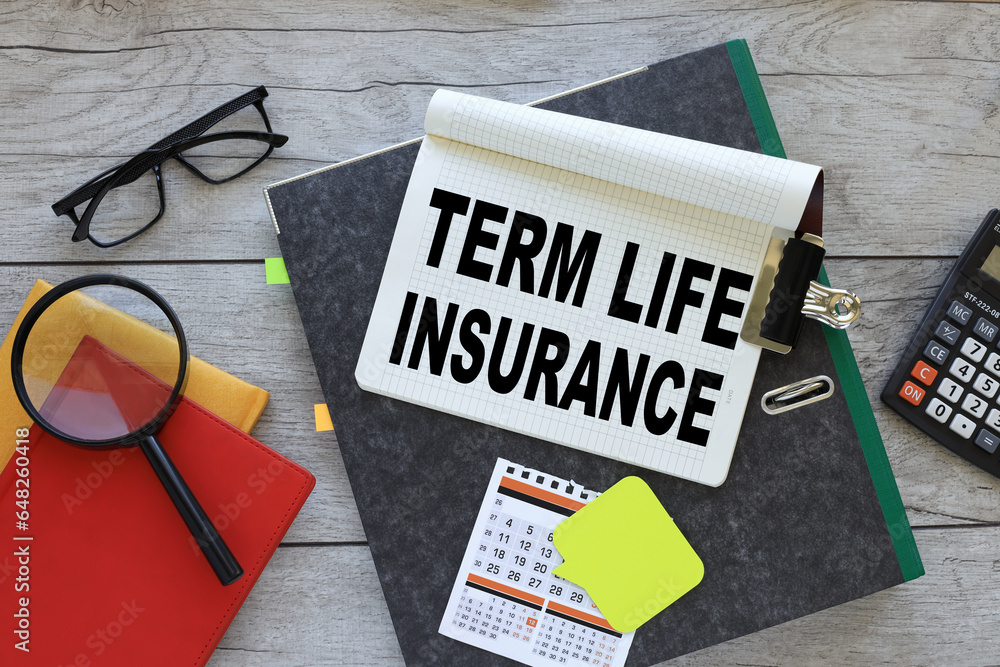 Poster term life insurance text on a notebook on a folder. red notepad. magnifying glass