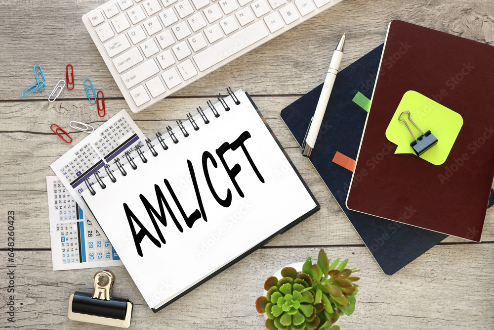 Aufkleber notepad with text aml cft . open notepad with text near white keyboard