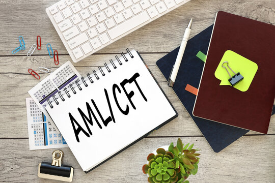 Notepad with text aml cft . open notepad with text near white keyboard