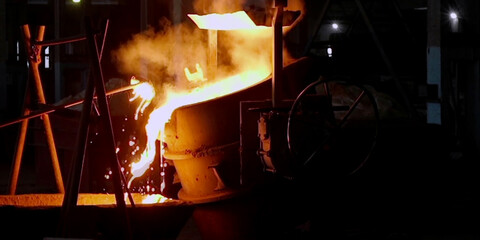 Metal cast process in blast furnace in metallurgical plant or factory. Liquid iron molten metal...