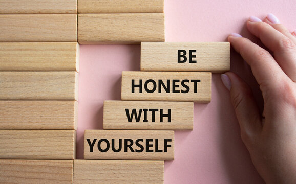 Be honest with Yourself symbol. Wooden blocks with words Be honest with Yourself. Businessman hand. Beautiful pink background. Be honest with Yourself concept. Copy space.