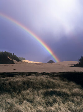 A Rainbow Brightens The Sky; Lakeside, Oregon, United States Of America