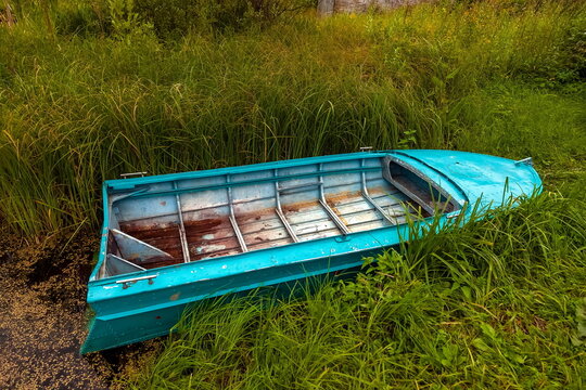 Duralumin boat in a grassy in river summer