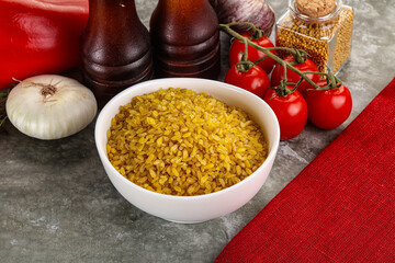 Dry wheat bulgur cereal heap