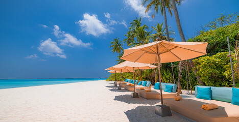 Panoramic holiday landscape. Luxury beach resort hotel. Leisure chairs loungers under umbrellas...