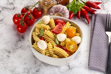 Italian pasta with mozzarella and tomato