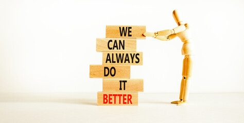 We make it better symbol. Concept words We can always do it better on wooden block. Beautiful white...
