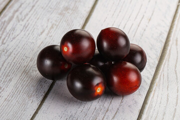 Raw ripe black kumato tomato