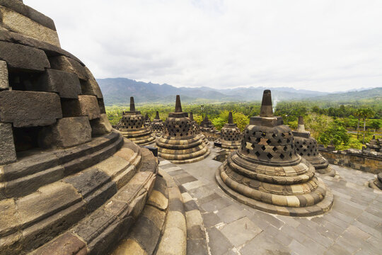 Latticed Stone Stupas Containing Buddha Statues On The Upper Terrace, Borobudur Temple Compounds, Central Java, Indonesia