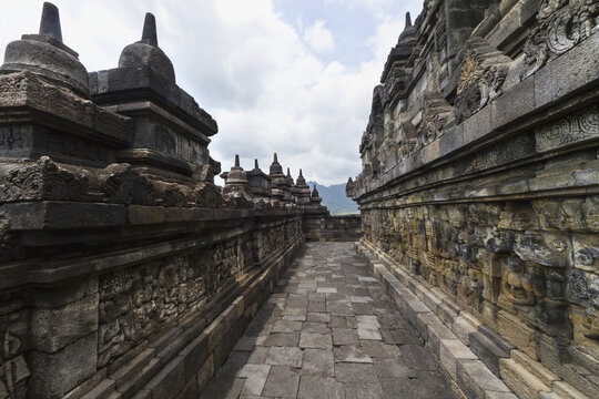 Bas-Reliefs Depicting The Life Of Buddha On A Gallery Of Candi Borubudur, Borobudur Temple Compounds, Central Java, Indonesia