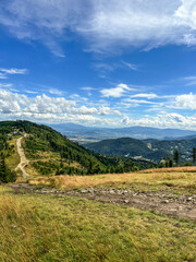 Fototapeta na wymiar Beskid Slaski mountain range in Poland. Descent from the Klimczok peak to the Klimczok tourist shelter