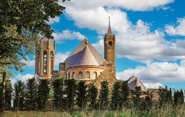 Fototapeten Beautiful medieval church in rural countryside village - Hout Blerick (Venlo), Netherlands © Ralf