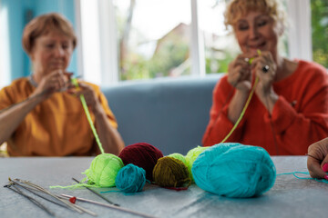 Senior women, knitting , friendship or old people, relaxing hobby in retirement. Elderly group,...