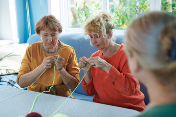 Senior women, knitting , friendship or old people, relaxing hobby in retirement. Elderly group,...