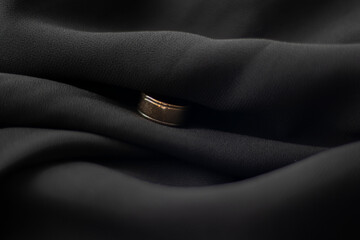 Ring. Gold ring in black