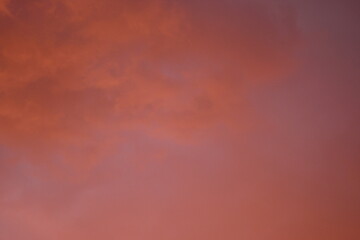 evening sunset, rays of the sun through cirrus pink clouds against the background of the sunset...