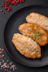 Delicious juicy cutlets or meatballs from minced chicken with salt and spices