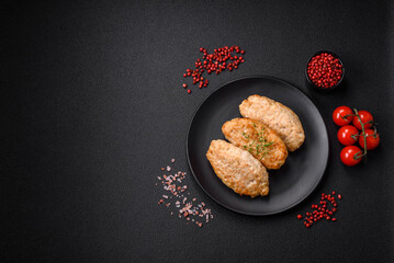 Delicious juicy cutlets or meatballs from minced chicken with salt and spices
