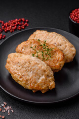 Delicious juicy cutlets or meatballs from minced chicken with salt and spices