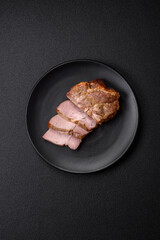 Delicious juicy pork or beef steak cooked on the grill with salt and spices