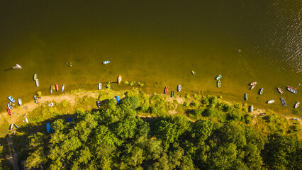 Top down view of beach on lake Sec with many boats. Popular tourist summer destination in Pardubicky kraj, Czech republic, European union.