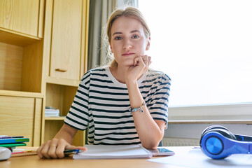 Webcam view of teenage girl student looking and talking to camera