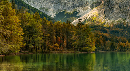 Nature colors during autumn in the mountains near a lake - 648298090