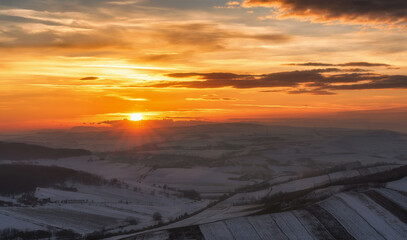 Sunset over countryside panorama during winter  - 648298099