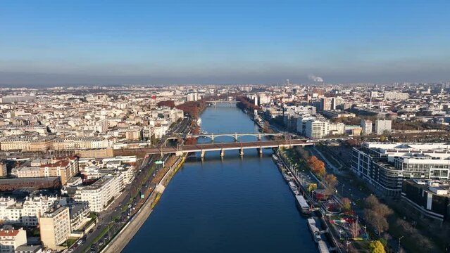 Sunny Paris skies: Seine, &Icirc;le de la Jatte, La D&eacute;fense, and a picturesque barge.
