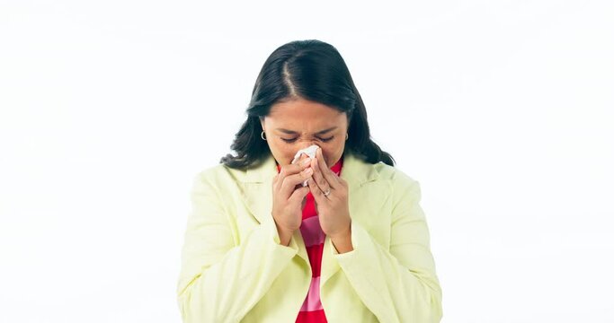 Sick, woman and blowing nose in studio for cold, allergies and risk of medical virus on white background. Asian model, tissue and sneeze for sinusitis, allergy and bacteria of winter flu infection