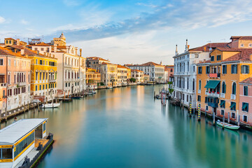 Long exposure picture with the Grand Canal at sunset or sunrise in Venice, Italy. - obrazy, fototapety, plakaty